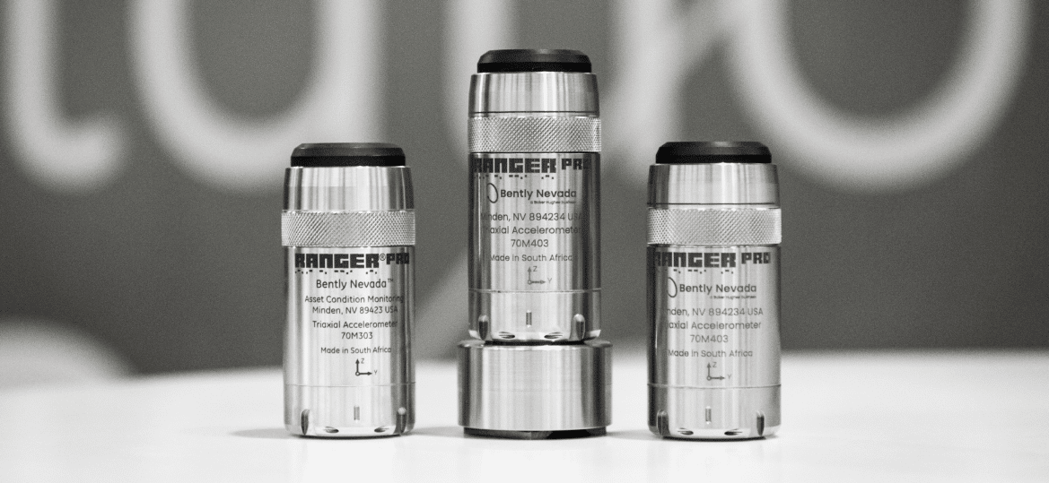 Three industrial sensor units labeled "Ranger Pro Sensor" by Bently Nevada, positioned upright on a flat surface, with a blurred background. These advanced devices are part of Baker Hughes' innovative Cordant™ technology suite.