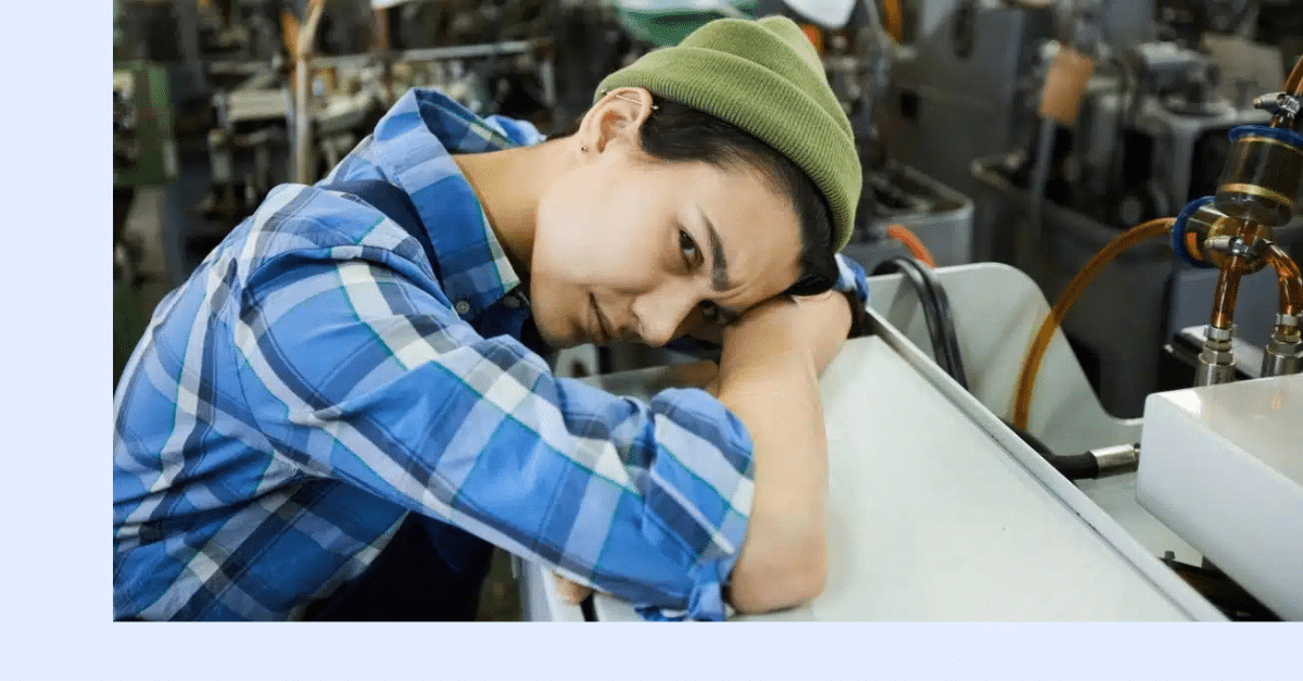 Female maintenance worker looking exhausted from doing reactive maintenance