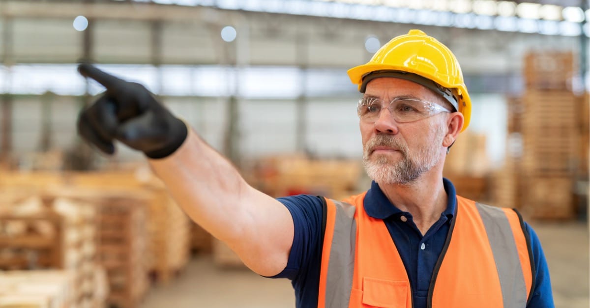 The power of Continuous Learning: confident engineer using screen while pointing to the future.